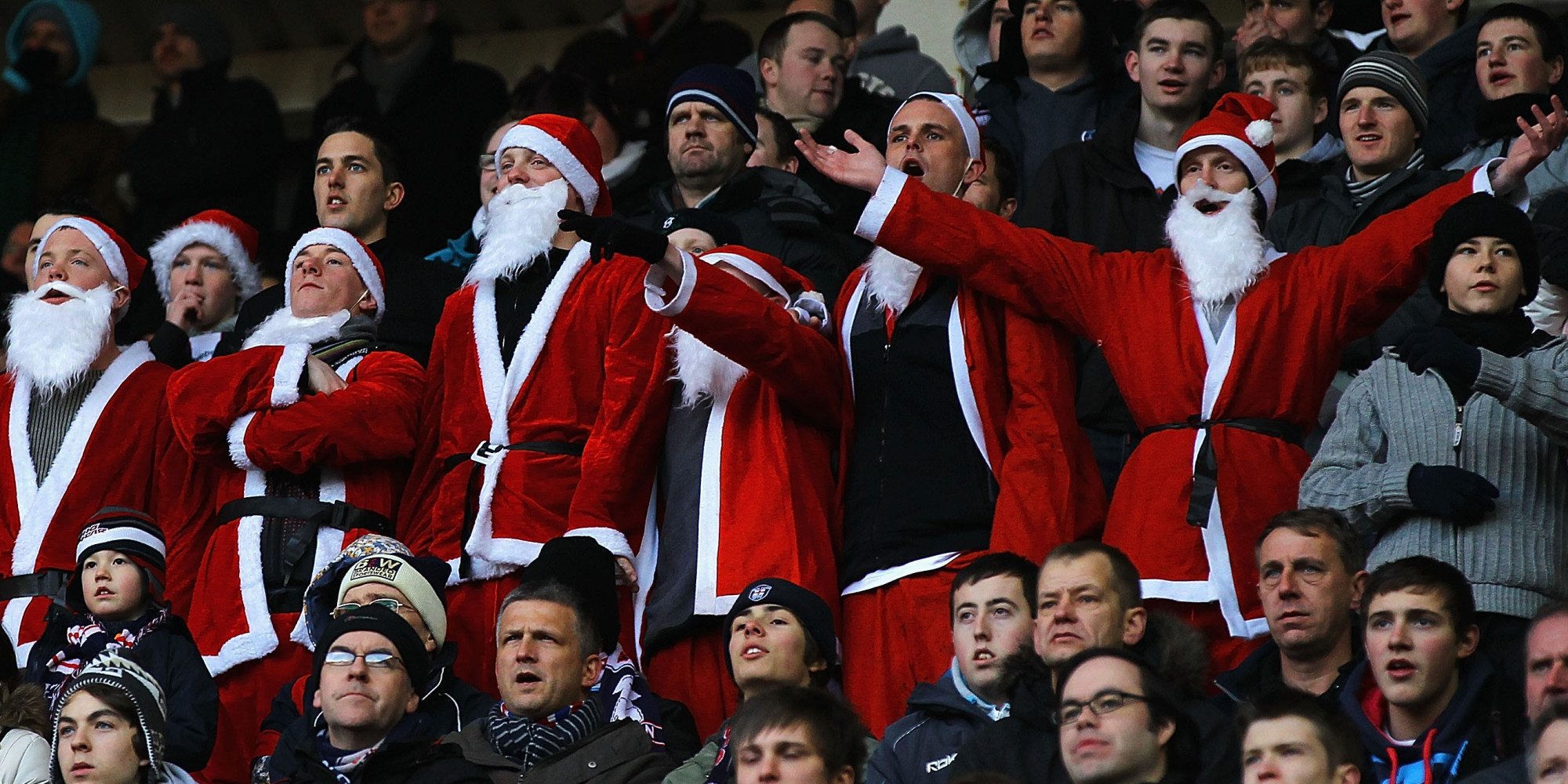 SUNDERLAND, ENGLAND - DECEMBER 18: Bolton Wanderers supporters dressed as Santa Claus watch from the stands during the Barclays Premier League match between Sunderland and Bolton Wanderers at Stadium of Light on December 18, 2010 in Sunderland, England. (Photo by Matthew Lewis/Getty Images)